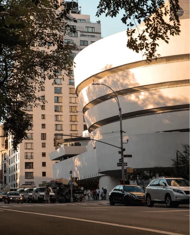 White curved museum building